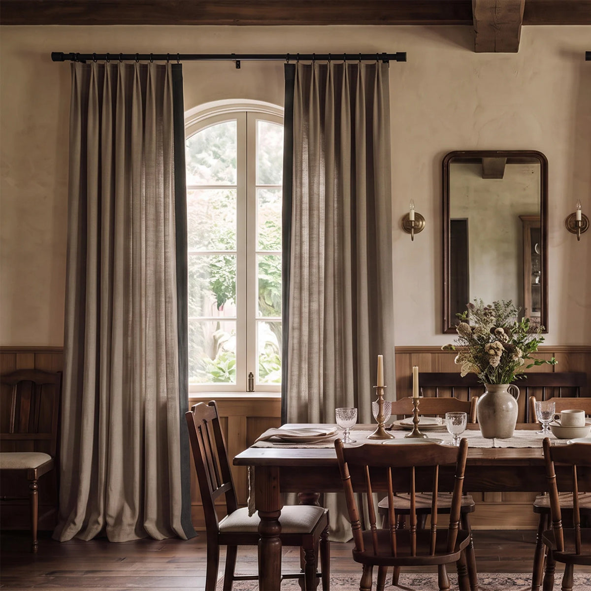 Two-tone tailored pleat curtains with a contrasting leading-edge border at a bright window.