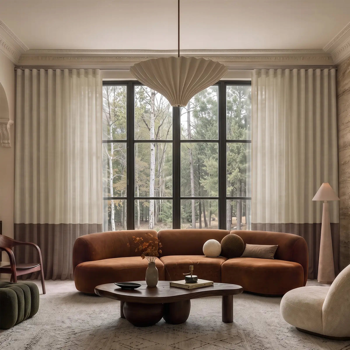 Two-tone ripple fold curtains with a contrasting bottom border at a bright window.