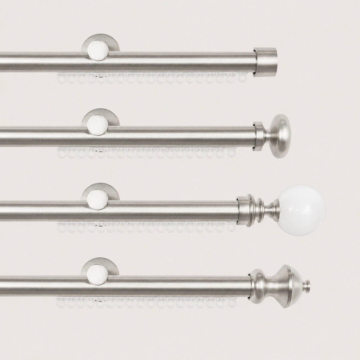 Brushed Silver Koda curtain rod with carrier track and four finial options.