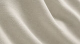 Alternate close-up of ivory curtain fabric showing its subtle texture.