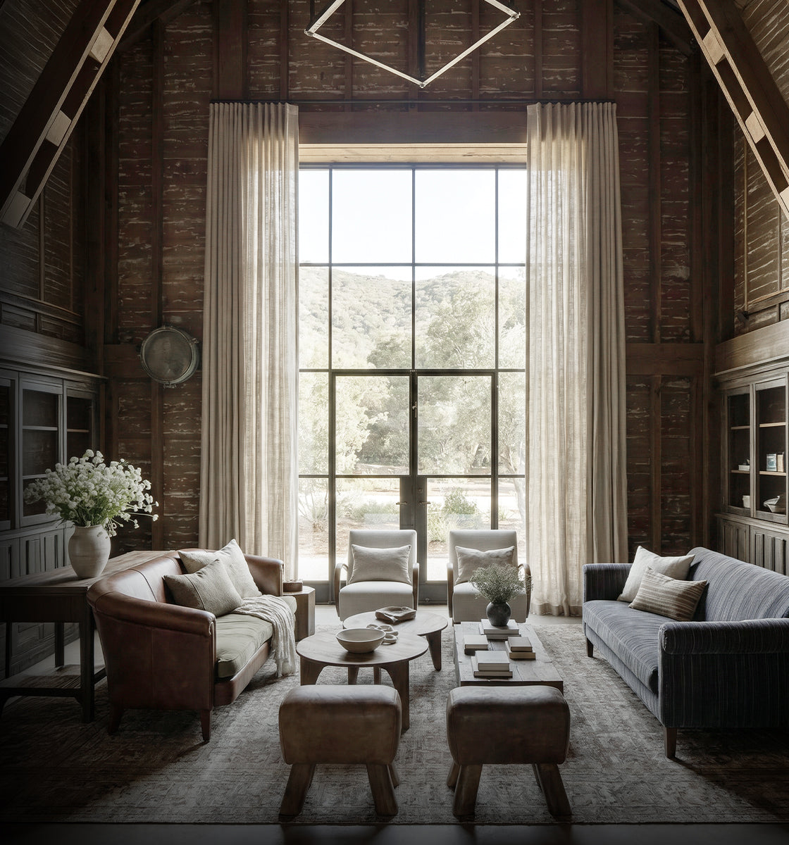 Tall curtains emphasizing a double-height living room window.