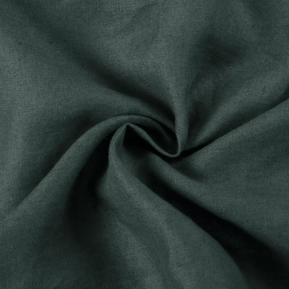 Close-up of moss green Aria linen fabric arranged in soft folds.