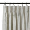 Natural linen curtains shown at the curtain header on black rings.